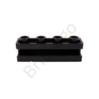 Black plastic component with multiple holes