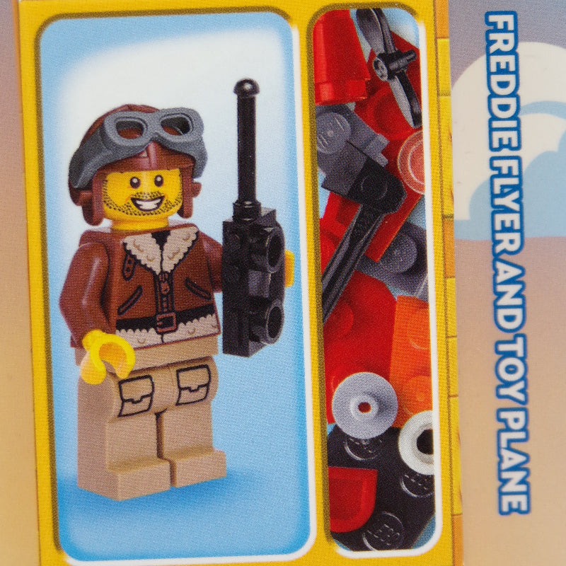 Toy set packaging with a character figure and parts on a yellow background