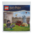 LEGO Harry Potter packaging with characters and castle model on a gray background