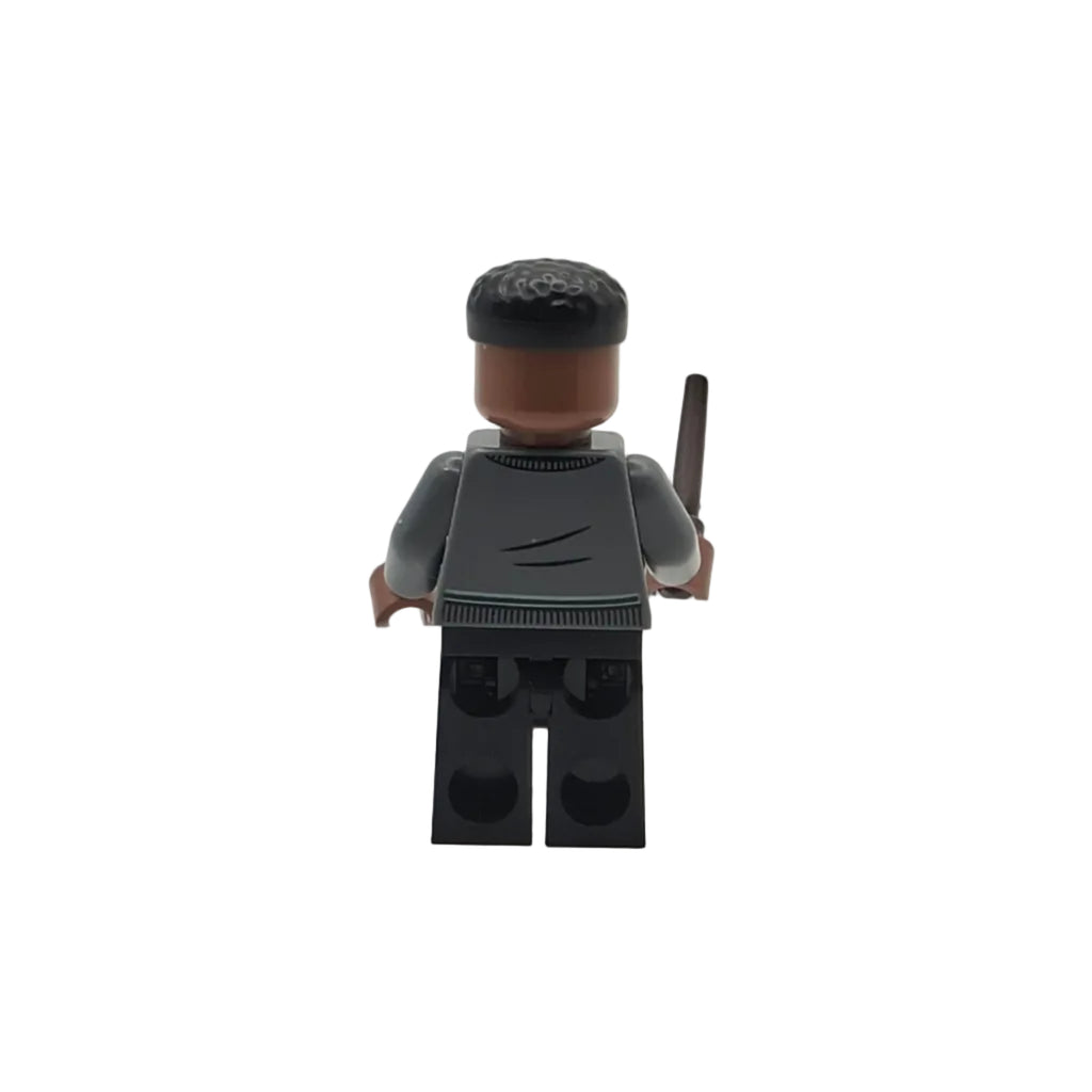 Toy figure with a black hat and gray outfit on a white background