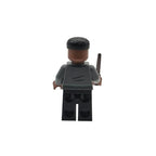 Toy figure with a black hat and gray outfit on a white background