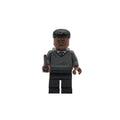 LEGO figure of a person wearing a gray sweater with a symbol on a white background