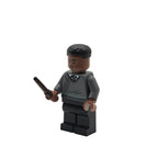 LEGO figure of a character holding a wand on a white background