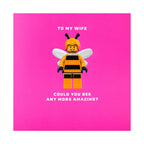 Toy figure of a bee with text on a pink background