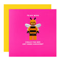 Greeting card with a bee-themed character and text on a pink background