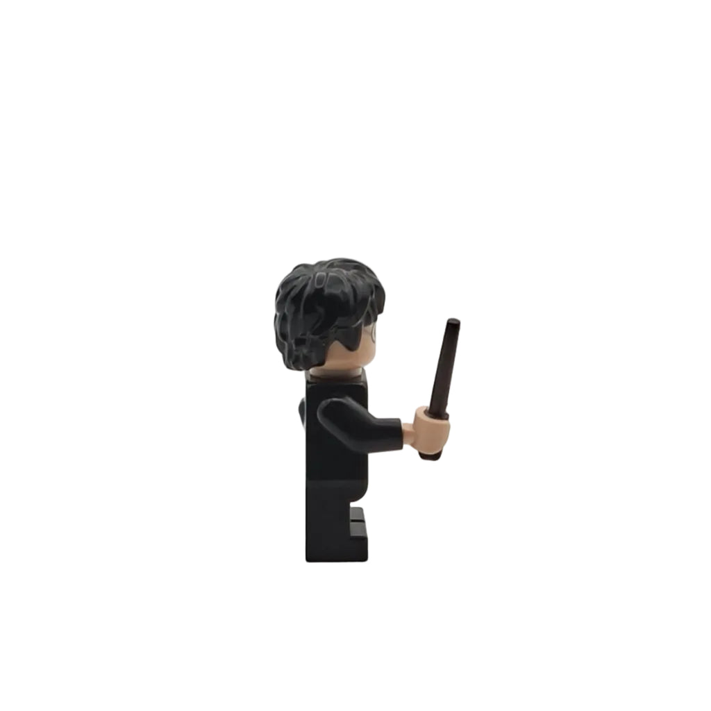 Black Lego figure holding a wand on a white background