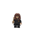 LEGO minifigure of a character in a dark outfit with a wand on a white background