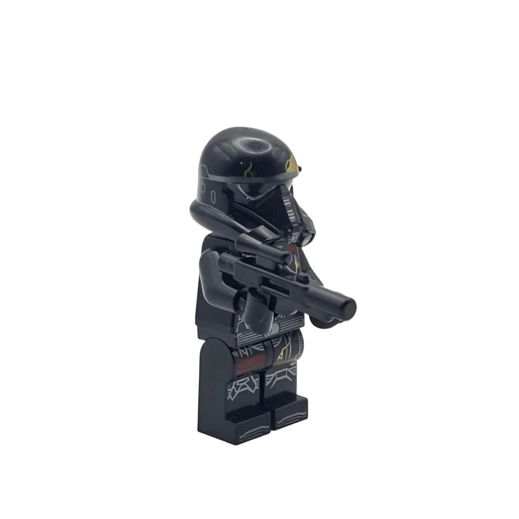 Black Lego figure with helmet and weapon on a white background