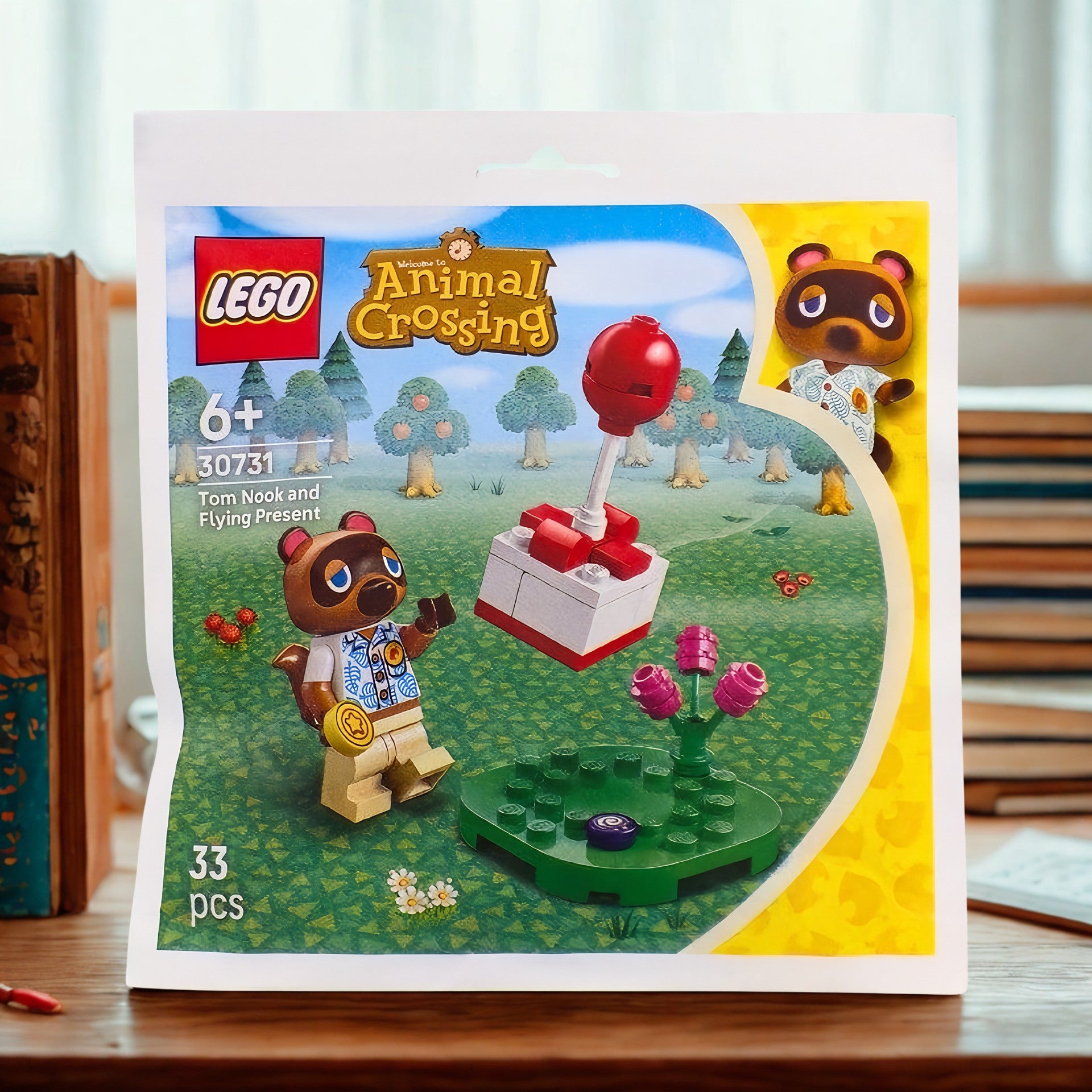 lego animal crossing recruitment bag with tom Nook with flying present set number 30731 33 pcs sitting on A desk