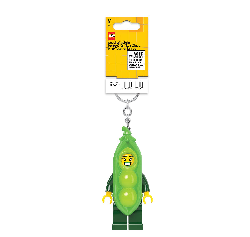 Green pea character key light with LEGO packaging on a white background