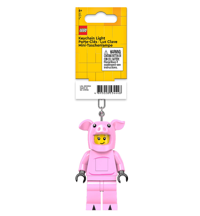 LEGO pig character keychain light with packaging on a white background