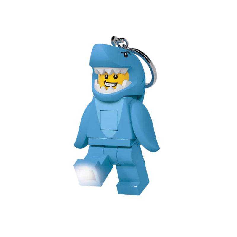 Blue Lego figure keychain with a light on a white background