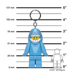 Blue hooded figure keychain with measurements against a white background