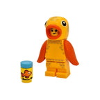 Toy figure of a yellow fish with orange fins on a white background