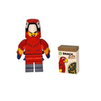 Red LEGO parrot figure next to a 'Snack Box' with a parrot design on a white background