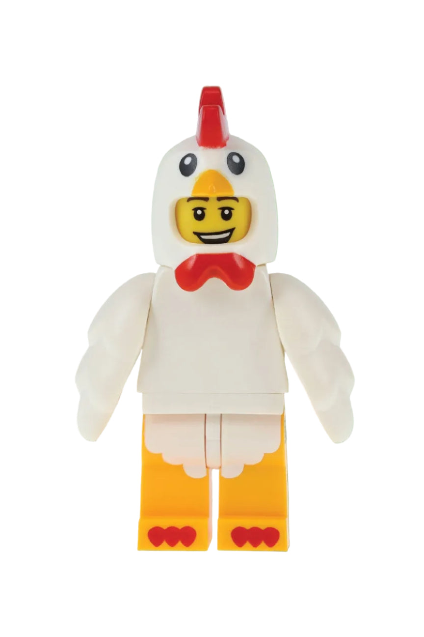 Toy figure of a chicken with a green background