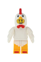 Toy figure of a chicken with a green background