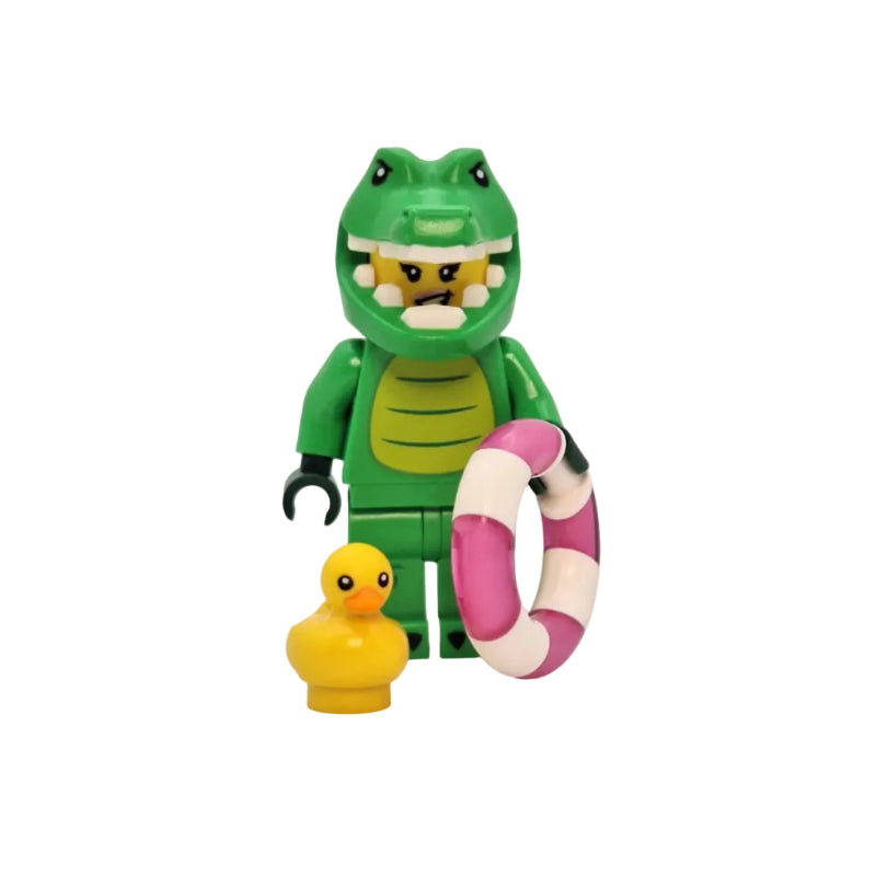 Toy figure of a green creature with a pink life preserver and yellow duck on a white background