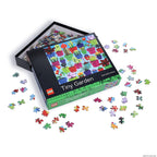 LEGO Tiny Garden puzzle set with pieces scattered on a white background