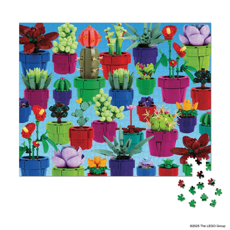 Colorful LEGO cacti and plants on a blue background with scattered pieces.
