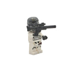 Minifigure in stormtrooper costume with weapon on a white background