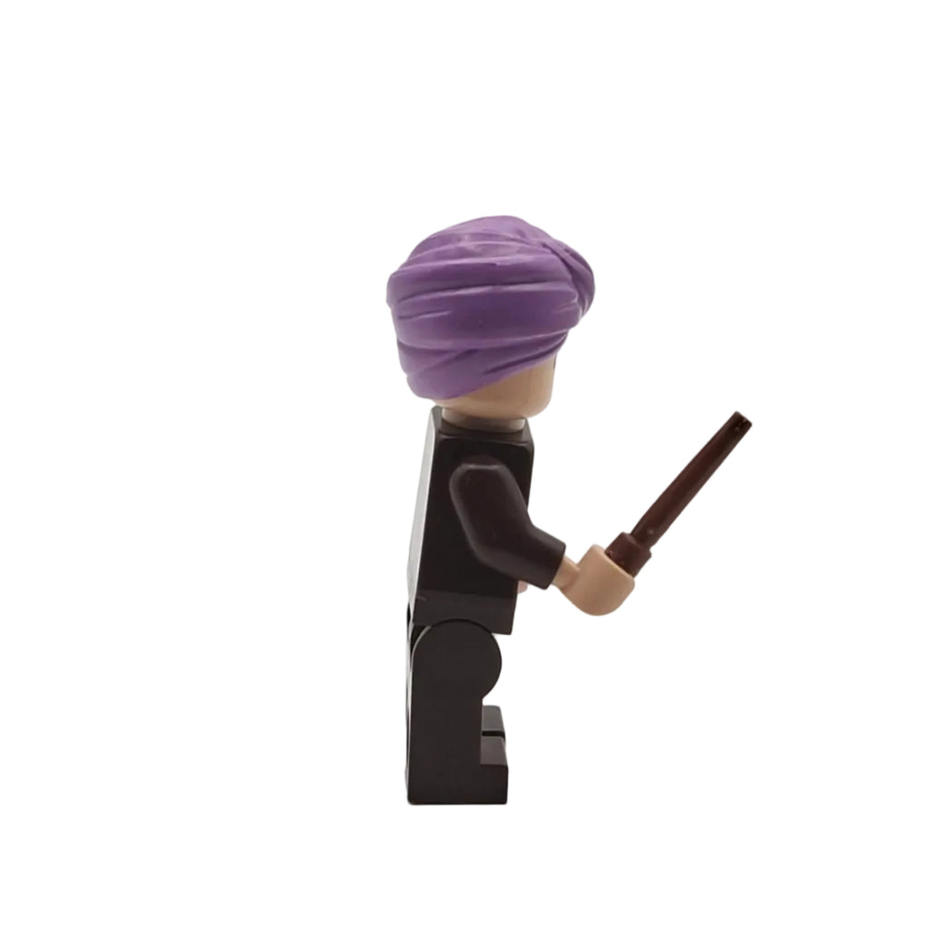 LEGO minifigure with a purple turban and wand on a white background